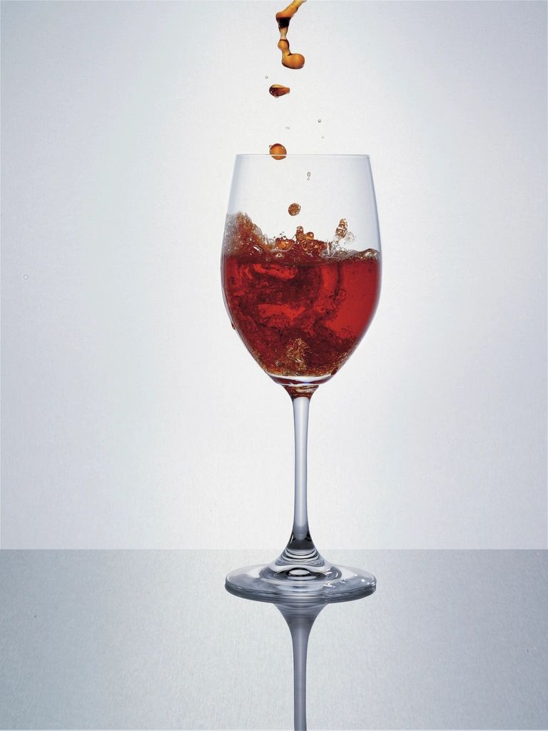 A cocktail being finished at the bar