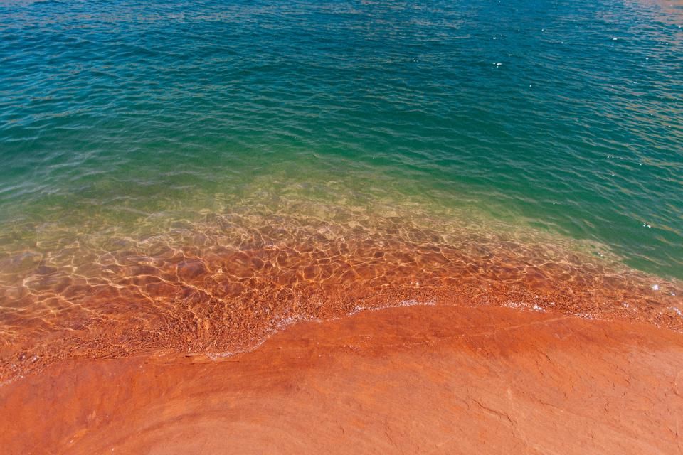 The beach and the water beyond it