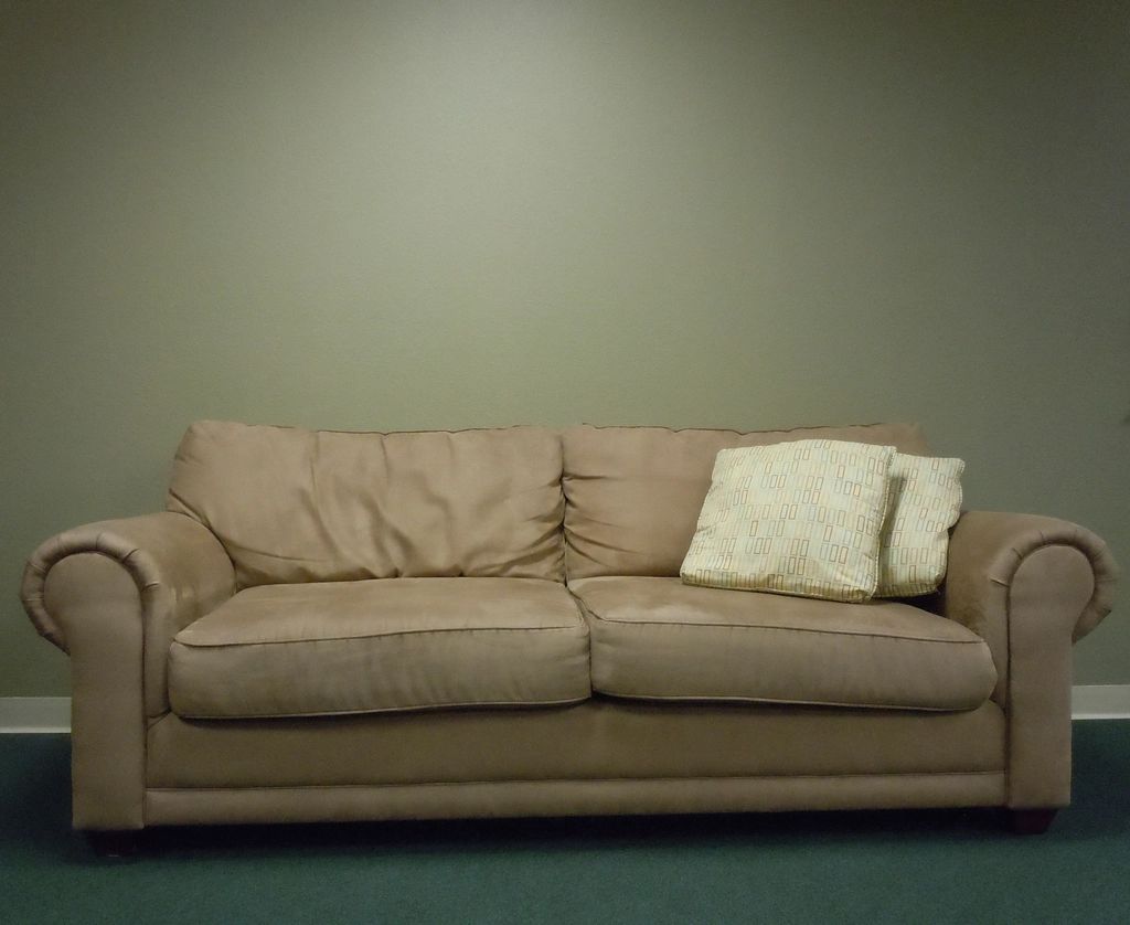A suite sitting room with a sofa and armchairs