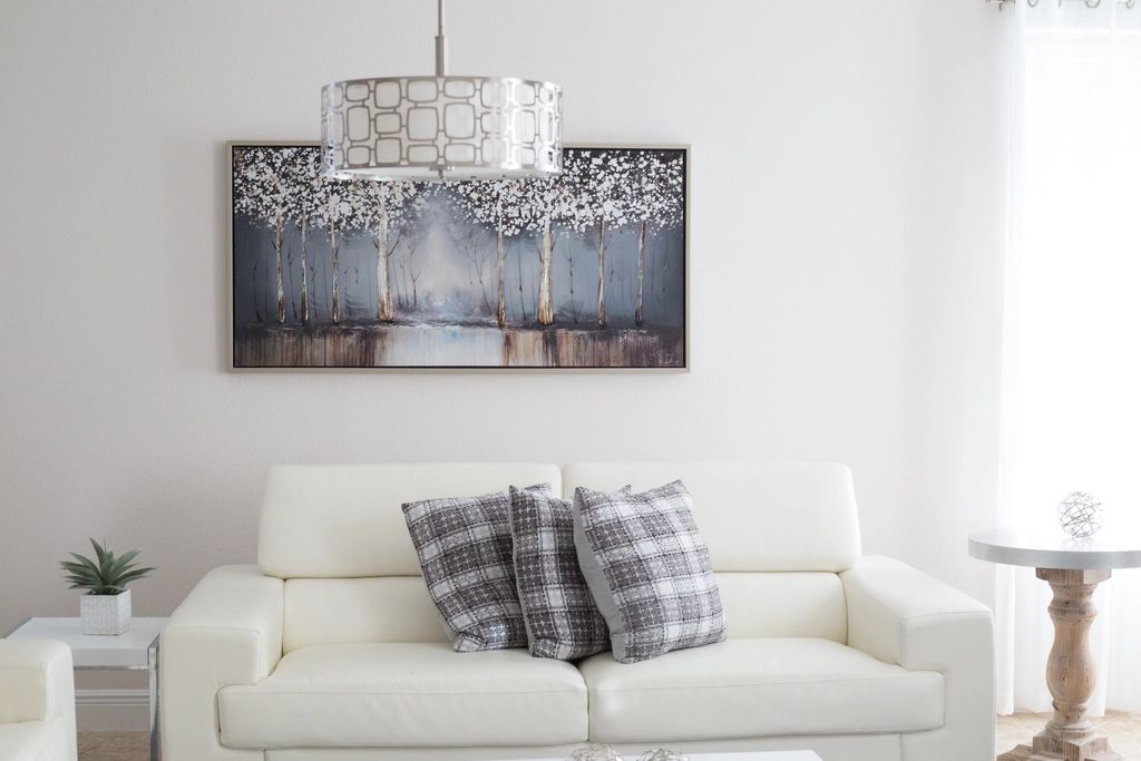 A suite sitting room with a sofa and armchairs
